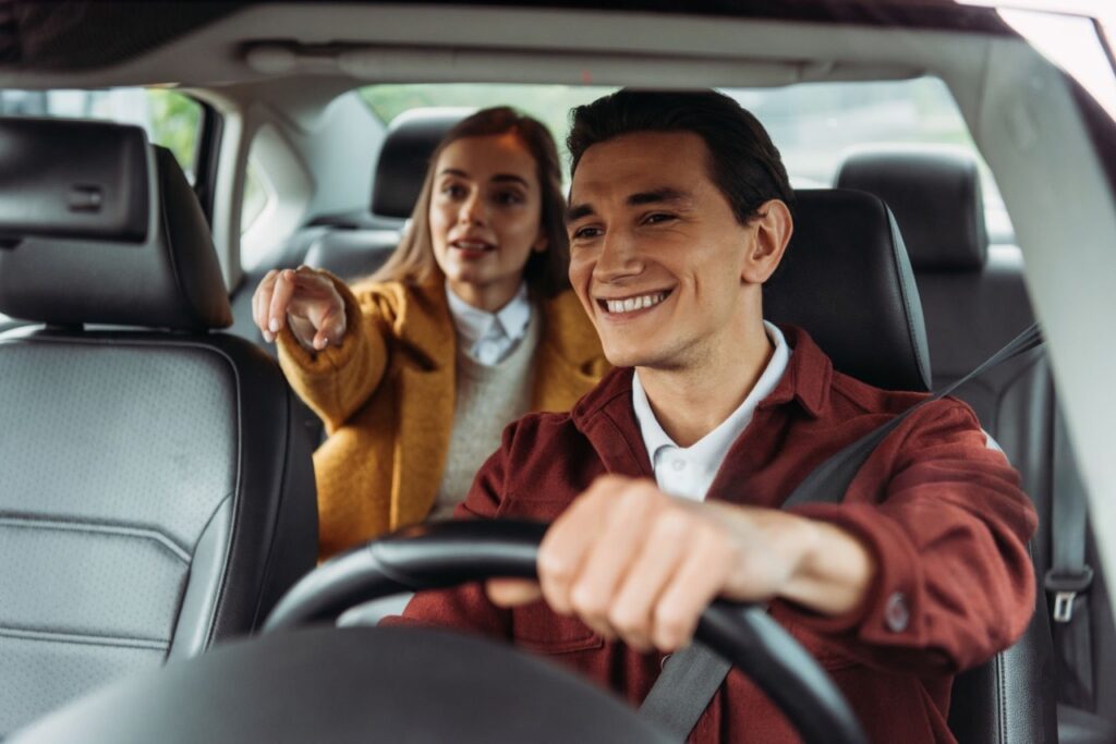 Passenger and Driver Smiling in Qglide taxi